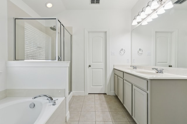 913 Lovebird Ln, Little Elm, TX 75068 - full bath featuring a garden tub, a shower stall, double vanity, and tile patterned floors