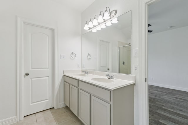 913 Lovebird Ln, Little Elm, TX 75068 - full bathroom with double vanity and an enclosed shower