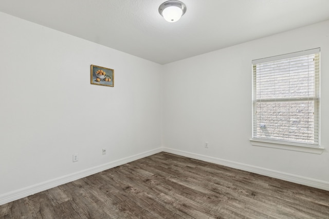 913 Lovebird Ln, Little Elm, TX 75068 - unfurnished room with dark wood-style flooring and baseboards