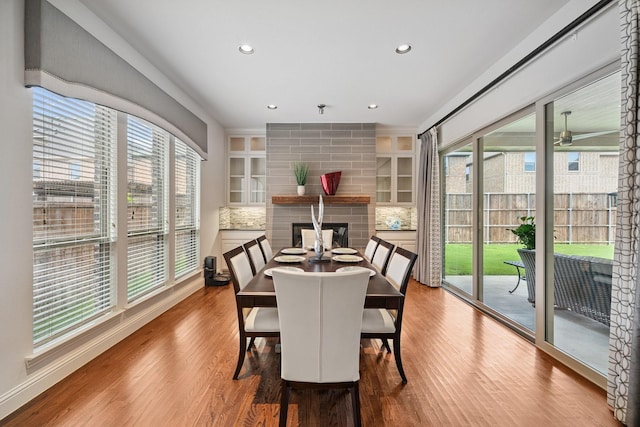 4652 Man O War Rd, Carrollton, TX 75010 - dining space featuring wood finished floors, healthy amount of natural light, and recessed lighting