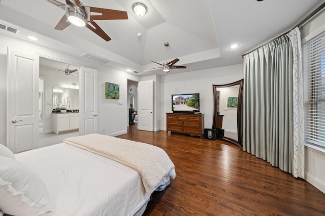 4652 Man O War Rd, Carrollton, TX 75010 - bedroom with wood finished floors, recessed lighting, a raised ceiling, a ceiling fan, and ensuite bath