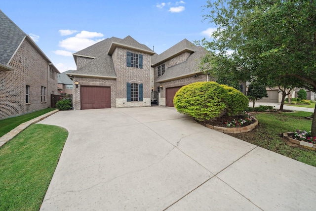 4652 Man O War Rd, Carrollton, TX 75010 - view of front of home featuring brick siding, driveway, and a shingled roof