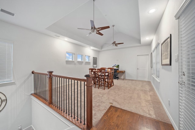 4652 Man O War Rd, Carrollton, TX 75010 - corridor with vaulted ceiling, carpet flooring, recessed lighting, wood finished floors, and an upstairs landing