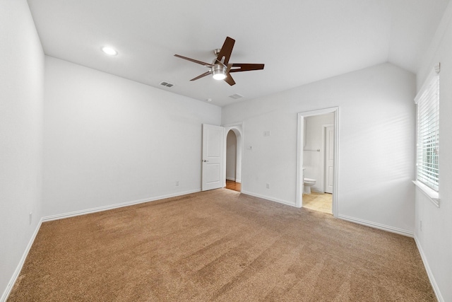 4652 Man O War Rd, Carrollton, TX 75010 - unfurnished bedroom featuring carpet floors, arched walkways, connected bathroom, recessed lighting, and a ceiling fan