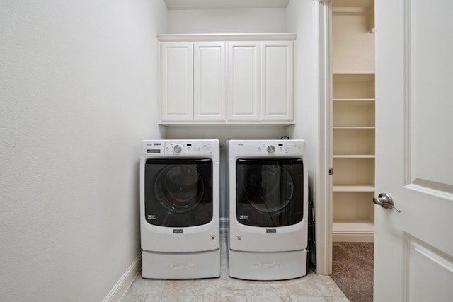 4652 Man O War Rd, Carrollton, TX 75010 - washroom featuring washing machine and dryer and cabinet space
