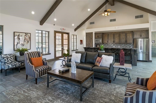 4652 Man O War Rd, Carrollton, TX 75010 - living area featuring light wood finished floors, beamed ceiling, a ceiling fan, french doors, and high vaulted ceiling