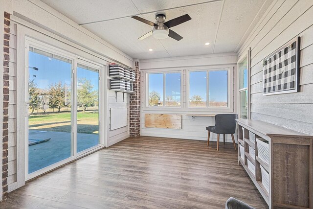 7910 Stone Ridge Dr, Northlake, TX 76247 - unfurnished sunroom with healthy amount of natural light, wood finished floors, recessed lighting, a textured ceiling, and wood walls