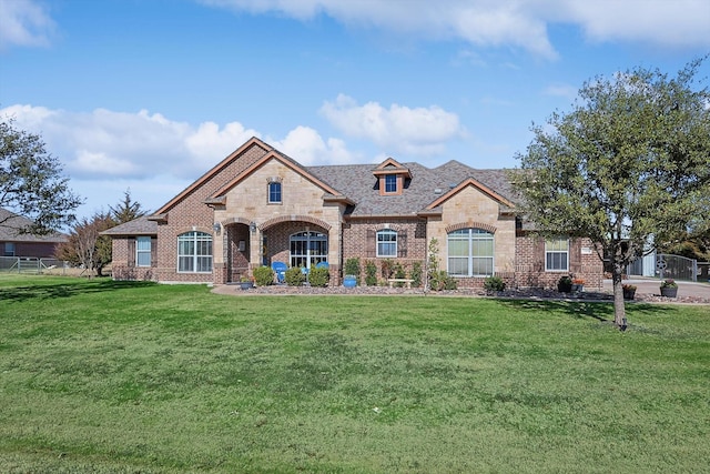 7910 Stone Ridge Dr, Northlake, TX 76247 - french country inspired facade featuring stone siding, a front yard, and brick siding