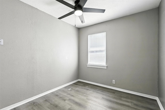 216 N Dobson St, Burleson, TX 76028 - empty room featuring wood finished floors and ceiling fan