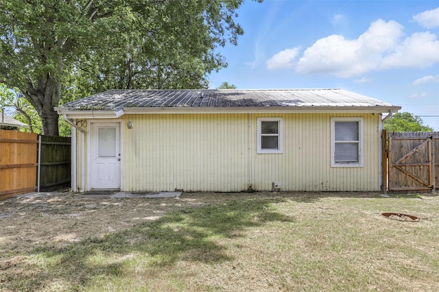 216 N Dobson St, Burleson, TX 76028 - rear view of property with a fenced backyard, a metal roof, and a gate