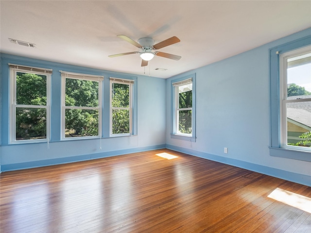 1114 W Congress St, Denton, TX 76201 - unfurnished room with healthy amount of natural light, ceiling fan, and hardwood / wood-style floors
