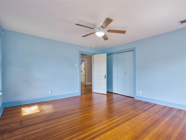 1114 W Congress St, Denton, TX 76201 - unfurnished bedroom featuring wood finished floors, a closet, and ceiling fan