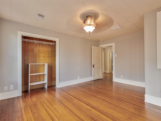 1114 W Congress St, Denton, TX 76201 - unfurnished bedroom featuring wood-type flooring and a ceiling fan