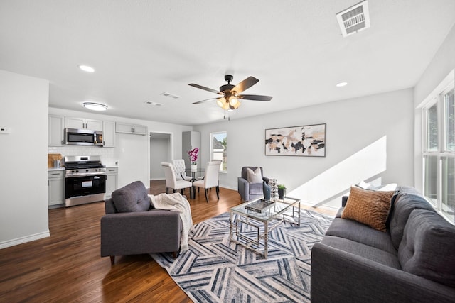 407 Bradley St, Dallas, TX 75224 - living room featuring dark wood-type flooring, a ceiling fan, and recessed lighting