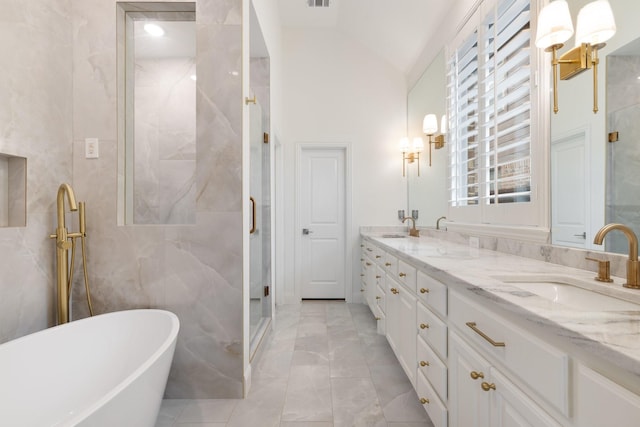 16317 Bidwell Park Dr, Prosper, TX 75078 - bathroom with a marble finish shower, double vanity, a soaking tub, marble finish flooring, and lofted ceiling
