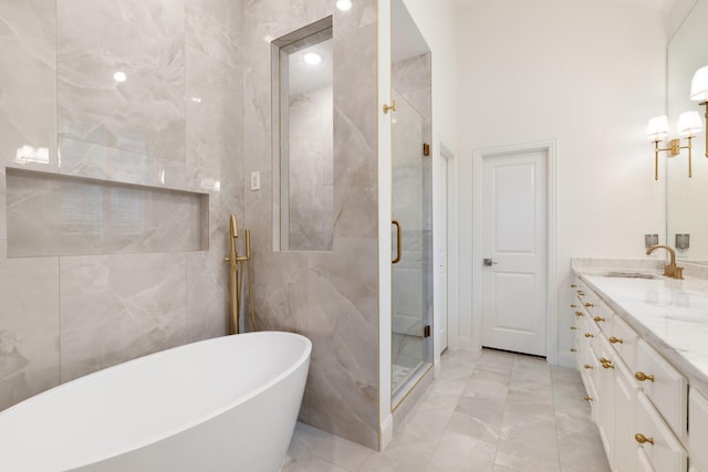 16317 Bidwell Park Dr, Prosper, TX 75078 - bathroom featuring marble finish flooring, a freestanding bath, a shower stall, and double vanity