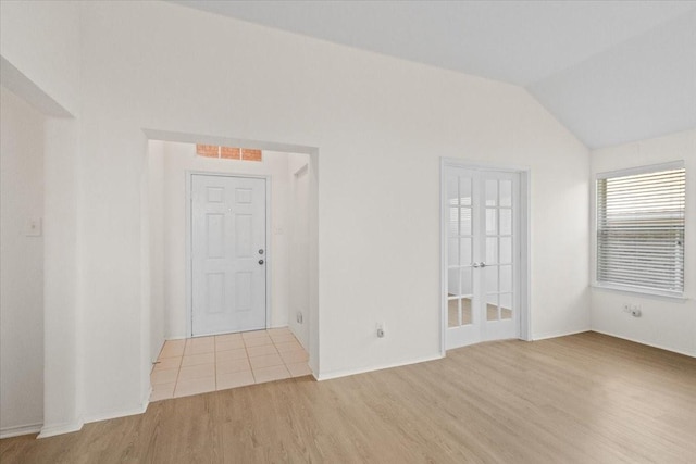 312 Goldeneye Ln, Fort Worth, TX 76120 - spare room with wood finished floors and vaulted ceiling