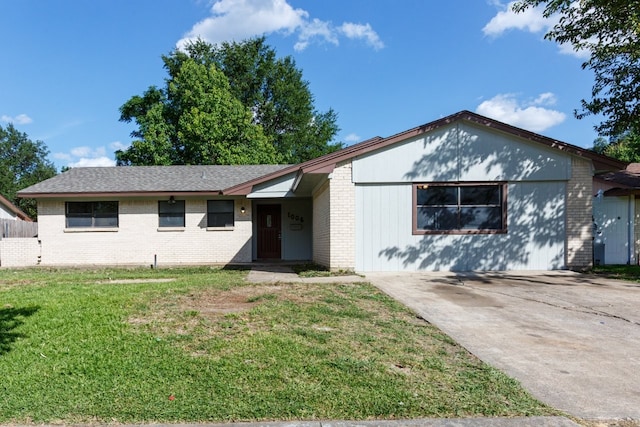 1006 Sleepy Hollow Dr, Garland, TX 75043 - ranch-style house with brick siding, a front lawn, and concrete driveway