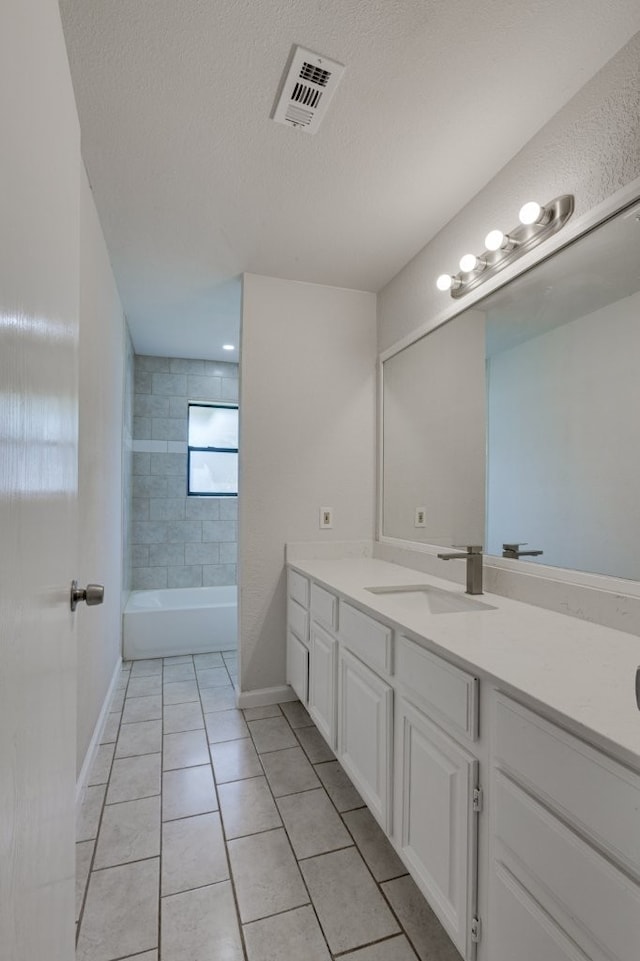 1006 Sleepy Hollow Dr, Garland, TX 75043 - full bathroom with vanity, tile patterned flooring, and a textured ceiling
