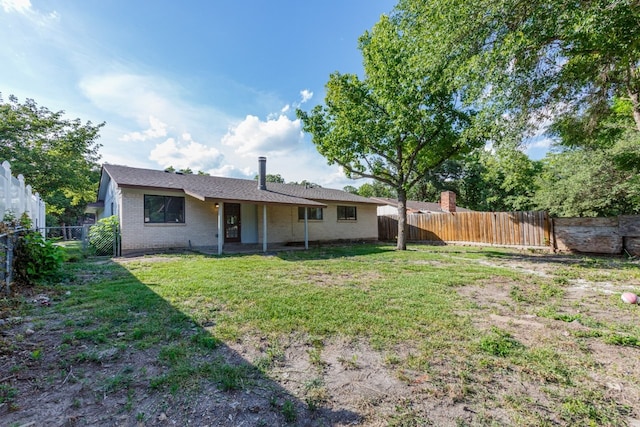 1006 Sleepy Hollow Dr, Garland, TX 75043 - back of property with a fenced backyard and brick siding