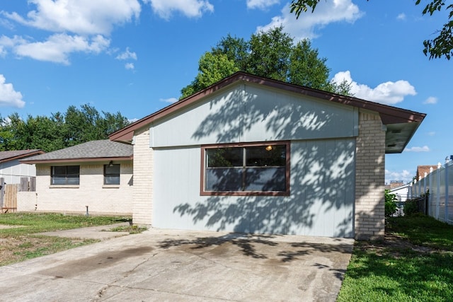 1006 Sleepy Hollow Dr, Garland, TX 75043 - view of side of home featuring a patio area and brick siding
