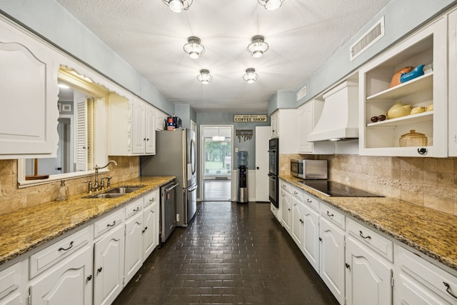 1509 Bar Harbor Dr, Dallas, TX 75232 - kitchen with black appliances, premium range hood, white cabinetry, decorative backsplash, and open shelves