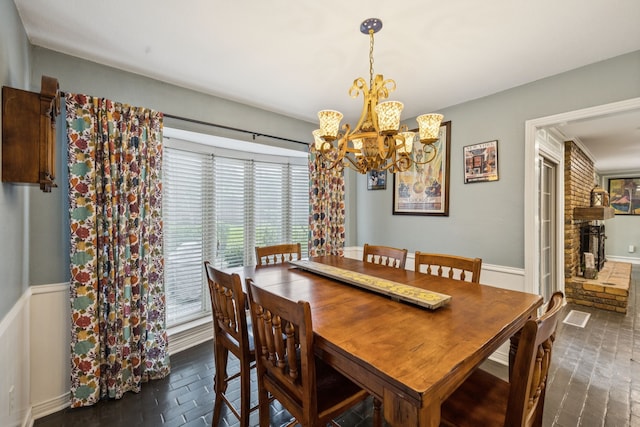 1509 Bar Harbor Dr, Dallas, TX 75232 - dining area with a chandelier, plenty of natural light, and brick floors
