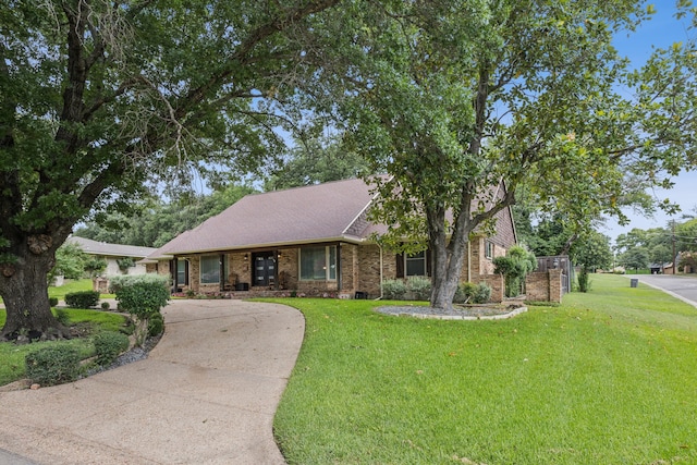 1509 Bar Harbor Dr, Dallas, TX 75232 - view of front facade with brick siding, a front lawn, and driveway