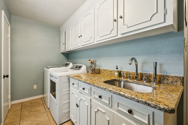 1509 Bar Harbor Dr, Dallas, TX 75232 - laundry area with washing machine and dryer, cabinet space, and light tile patterned floors