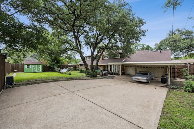 1509 Bar Harbor Dr, Dallas, TX 75232 - view of front facade featuring a garage, a storage shed, and driveway