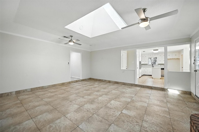 8109 Starnes Rd, North Richland Hills, TX 76182 - unfurnished living room with a ceiling fan, ornamental molding, and a skylight