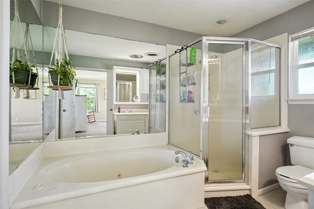 201 N Frederick St, Ponder, TX 76259 - full bathroom with a tub with jets, vanity, a stall shower, and tile patterned flooring