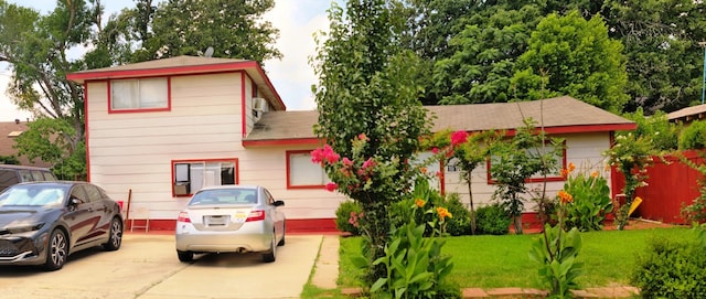 161 W Shore, Lewisville, TX 75057 - view of front of property featuring roof with shingles and a front lawn