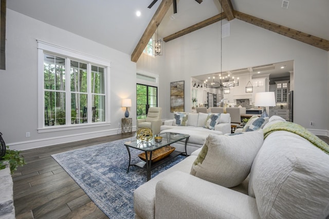 14631 Reserve Ct, Tyler, TX 75707 - living room featuring a chandelier, high vaulted ceiling, beamed ceiling, a ceiling fan, and wood finished floors