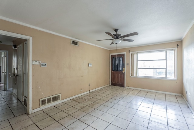 4608 Sandra Lynn Dr, Mesquite, TX 75150 - spare room featuring ornamental molding, a ceiling fan, and light tile patterned floors