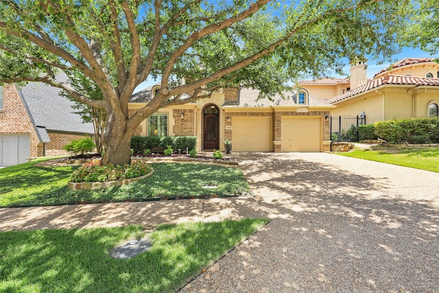 1682 Morris Ln, Frisco, TX 75034 - view of front of house with a garage, driveway, brick siding, and a chimney