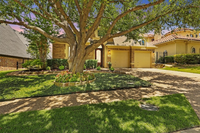 1682 Morris Ln, Frisco, TX 75034 - view of front of home with driveway, brick siding, an attached garage, a front lawn, and a tiled roof