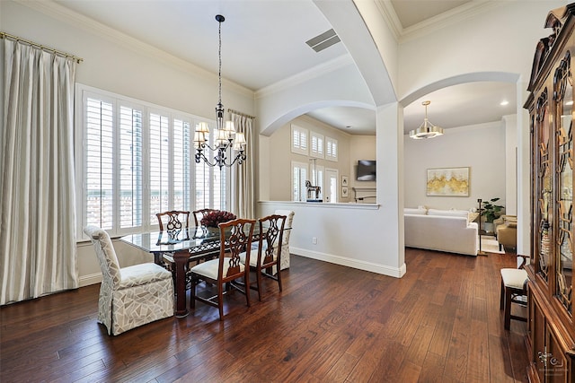 1682 Morris Ln, Frisco, TX 75034 - dining room featuring arched walkways, a chandelier, healthy amount of natural light, and crown molding