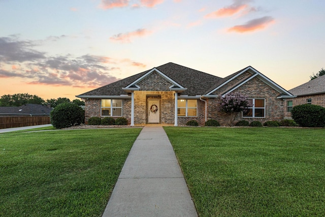 102 Southfork Cir, Pottsboro, TX 75076 - view of front of property featuring a lawn, brick siding, and a shingled roof