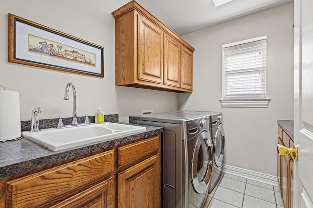 102 Southfork Cir, Pottsboro, TX 75076 - washroom featuring separate washer and dryer, cabinet space, and light tile patterned flooring