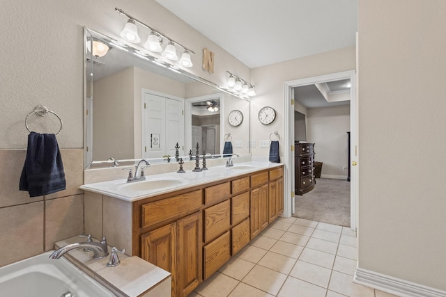102 Southfork Cir, Pottsboro, TX 75076 - full bath with tile patterned floors, double vanity, a jetted tub, and a ceiling fan