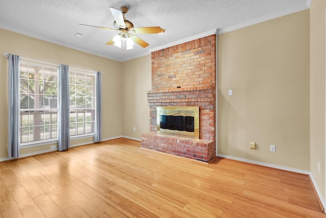 495 Loren Boyd Rd, Combine, TX 75159 - unfurnished living room featuring a textured ceiling, light wood-style floors, crown molding, ceiling fan, and a fireplace