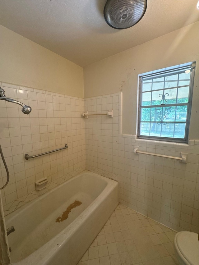 817 Brook Valley Ln, Dallas, TX 75232 - full bath with tile patterned flooring, a bathtub, tile walls, a shower, and a wainscoted wall