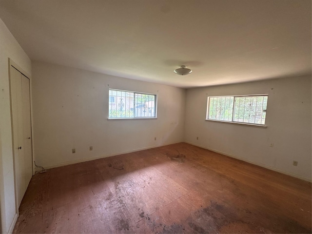 817 Brook Valley Ln, Dallas, TX 75232 - unfurnished bedroom featuring multiple windows