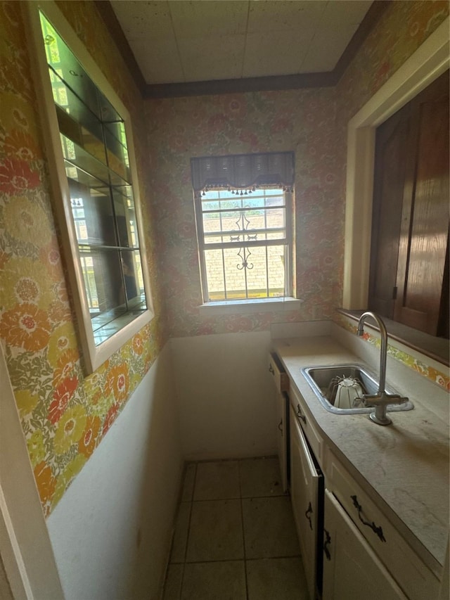 817 Brook Valley Ln, Dallas, TX 75232 - kitchen featuring wallpapered walls, light countertops, tile patterned flooring, and white dishwasher