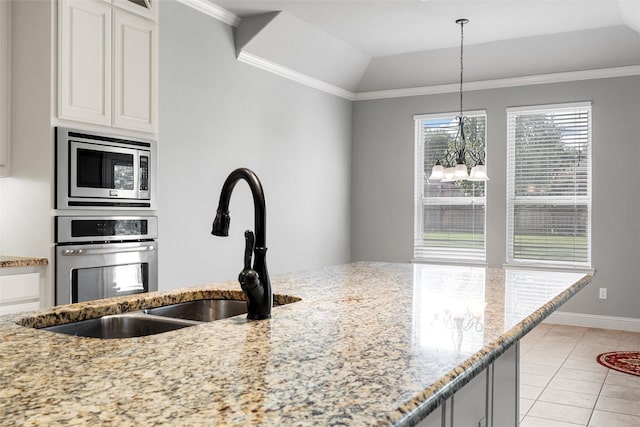 732 Windhill, Hewitt, TX 76643 - kitchen featuring appliances with stainless steel finishes, light stone counters, light tile patterned floors, white cabinets, and pendant lighting
