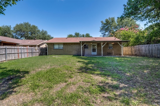 4137 Salem Dr, Garland, TX 75043 - back of house featuring brick siding, a fenced backyard, and a patio area