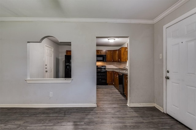 4137 Salem Dr, Garland, TX 75043 - kitchen with black appliances, dark wood-type flooring, ornamental molding, brown cabinets, and light countertops
