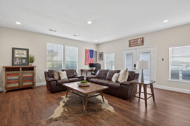 1709 Blair Ct, Carrollton, TX 75010 - living room with dark wood-style floors, recessed lighting, and french doors