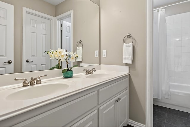 1709 Blair Ct, Carrollton, TX 75010 - bathroom with double vanity, tile patterned floors, and shower / bath combo